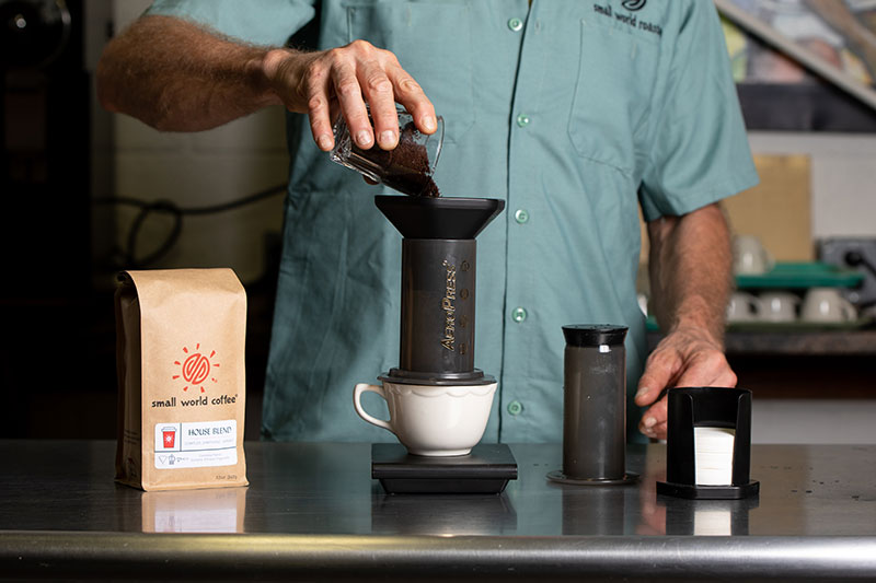 Grind coffee fine and pour into aeropress.